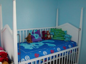 A crib is a little, snug bed with high sides called slats.