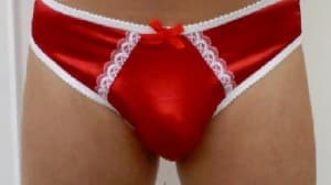He is a Red Pants Man and is positioned in front of the photo session.