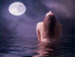 A woman was seated for a photo shoot during the moonlight swim.
