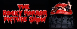 A terrified woman is sitting on the sofa in the Rocky Horror Picture Show.