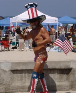 He is a senior citizen from California and is standing on the seashore.