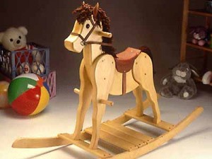 A rocking horse is a common activity for kids made of wood.