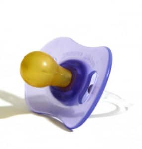 A blue-colored pacifier called a Nipple was left on the ground during the photo shoot.