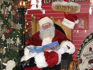 Santa Claus Man is dressed in traditional Santa Claus garb.