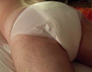 An attractive and sexy diaper is displayed for the photo session.