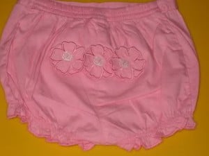 A pink skirt that has a beautiful designer embroidery work.