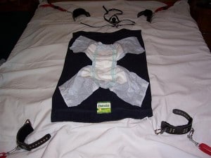 Diaper Bondage as Punishment The baby's diaper was in bed.