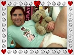 Lovely diaper Boy is posing for the photograph while donning the t-shirt.