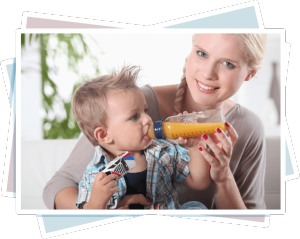 An Snack of Juice Mom was using a baby feeding bottle to feed the youngster.