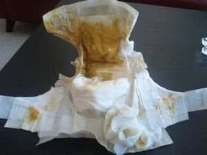 An unclean diaper Additionally, it was white and kept on the floor.