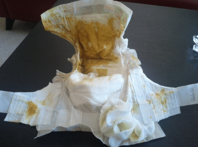 An unclean diaper Additionally, it was white and kept on the floor.