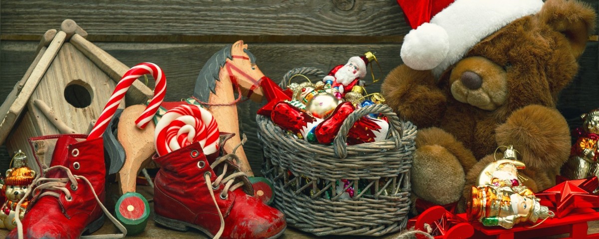 There are displays of Christmas decorations, including teddy bears, Christmas hats, shoes, and other items.