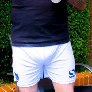 A man wearing the white diaper is standing.