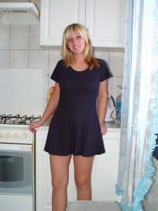 Standing there is a lovely female who appears hot and seductive.