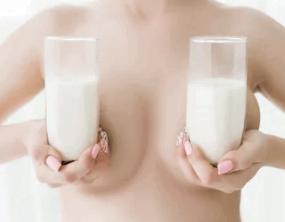 She is breastfeeding while posing for the shots and exposing her bare breasts.