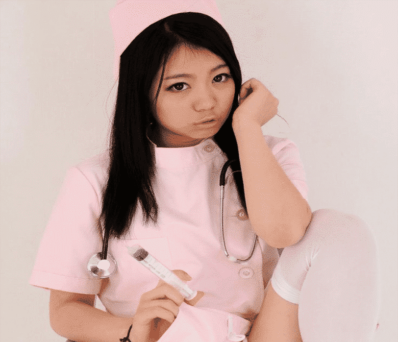 A nurse girl is standing, looking seductive, and experiencing injection.