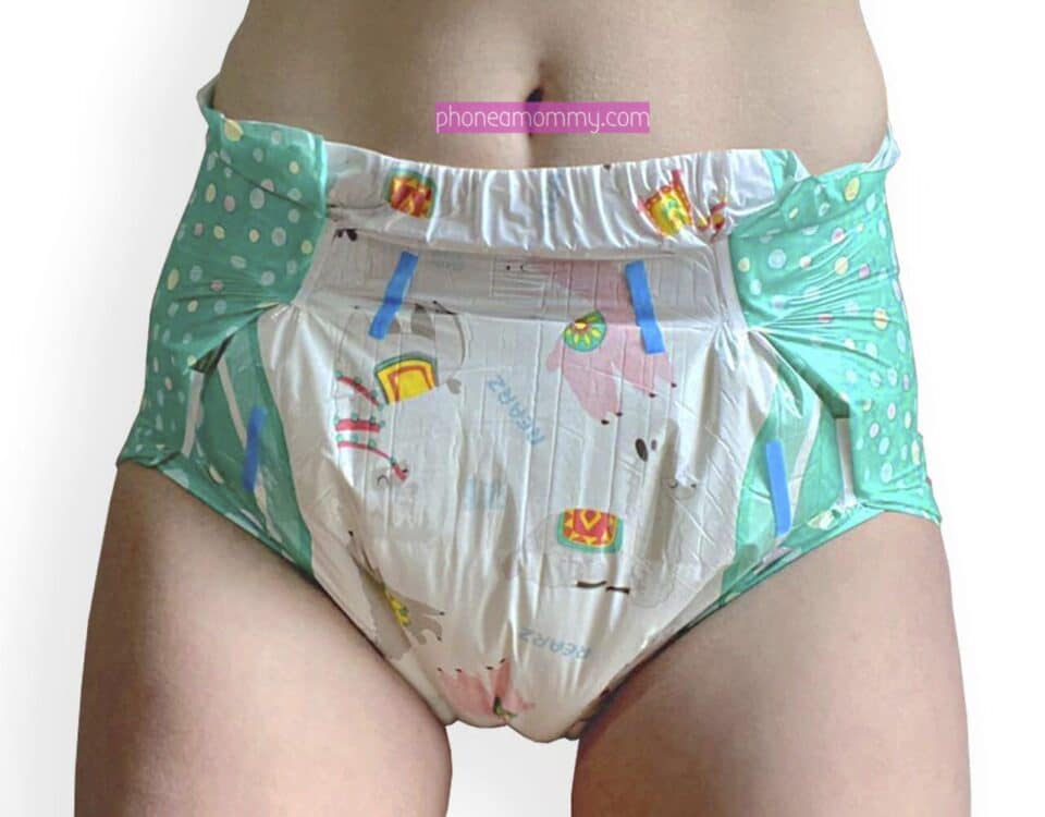 The diaper The diaper-wearing fetishist is standing with the green diaper on.
