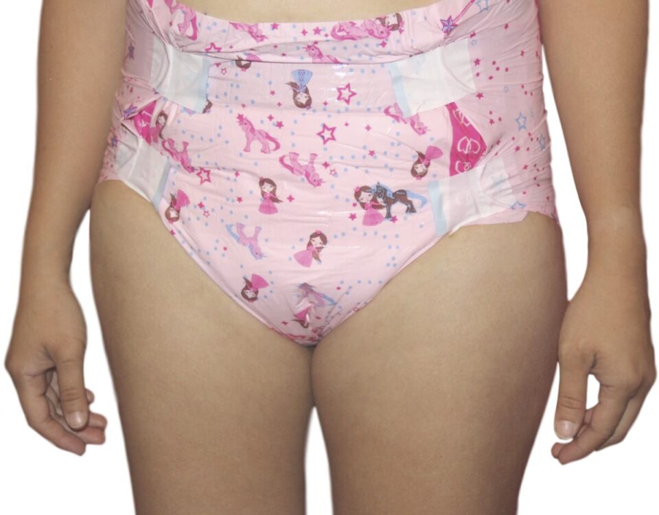 A woman engaged in diaper fetish stands in front of the picture session wearing the pink attire.