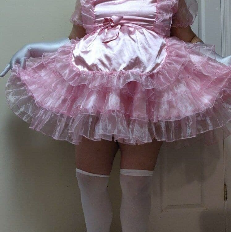 In the picture, there is a man wearing a gorgeous diaper and standing.